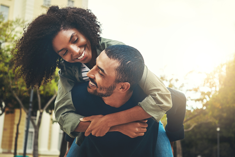 Young couple smiling at each other